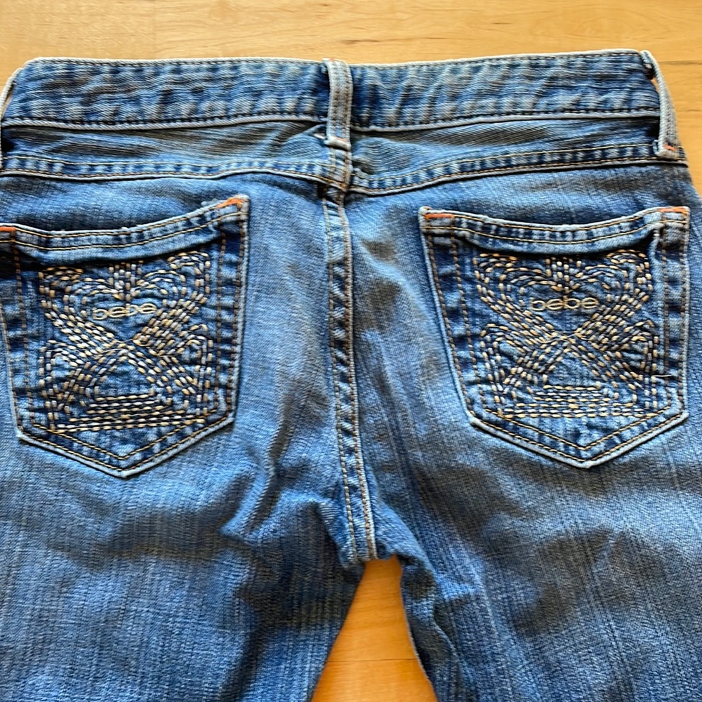 Bebe blue dark jean boot cut 27 32 spandex stretch yellow stitch